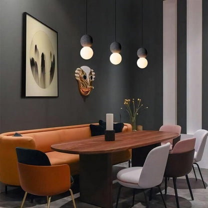 Suspension Origo – Design Géométrique en Zement, Pierre Volcanique et Verre Opale